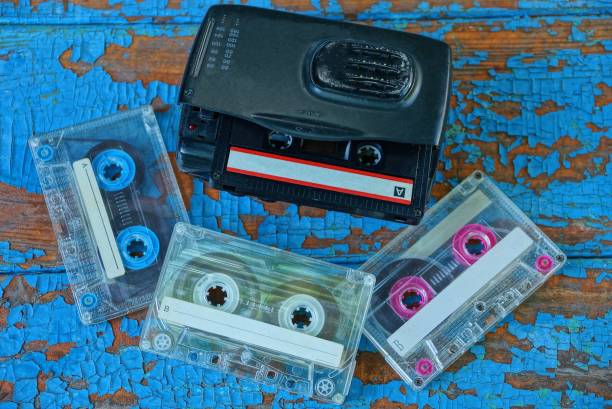 istock player with a cassette is lying on a worn blue table 1163128137