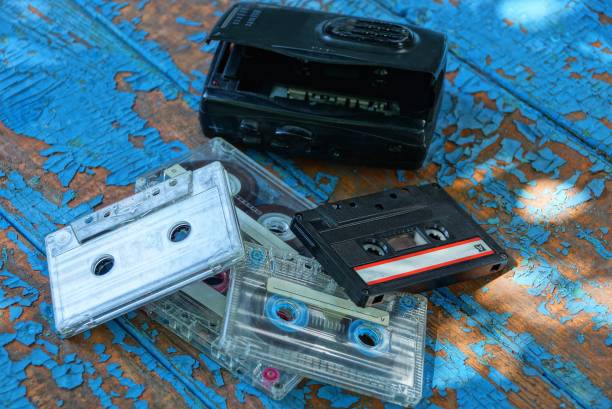 istock audio player with a cassette is lying on a worn blue table 1163128164