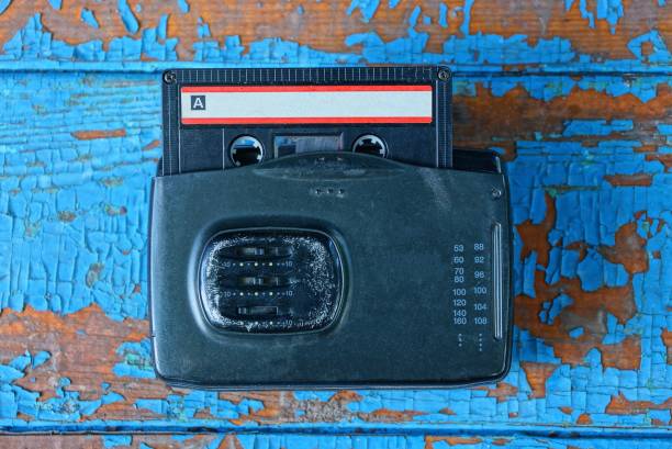 istock old black audio player with a cassette is lying on a worn blue table 1163128237