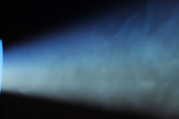 istock lue rays of light through the smoke from the projector 1163128421