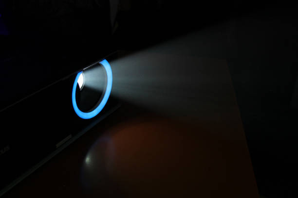 istock lue rays of light through the smoke from the projector 1163128423