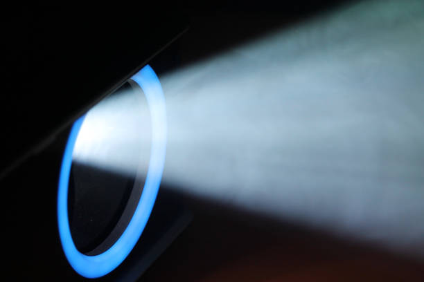 istock lue rays of light through the smoke from the projector 1163128430