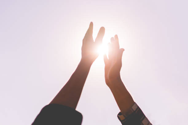 istock two friends beat high five outdoors on a summer day, friendship success relationship 1163129037