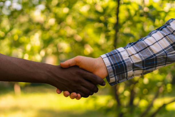 istock farmers shake hands, sign contract, agriculture concept 1163129041