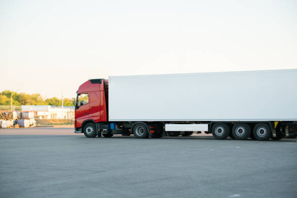 istock huge truck with wagon delivering some package outdoor 1163129186