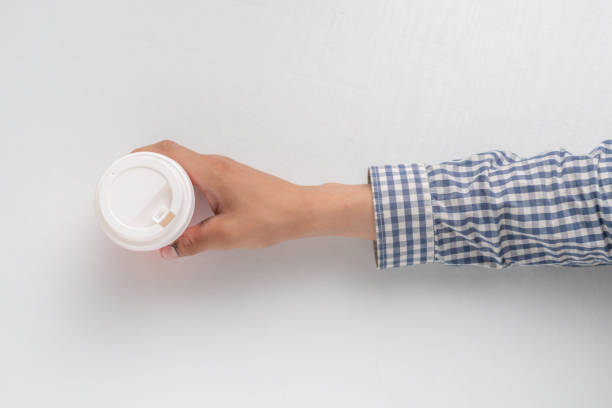 istock top view of hands holding a take away paper coffee cup 1163129312
