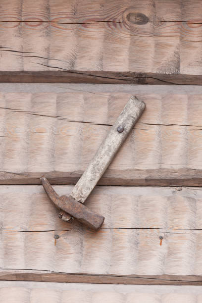 istock Old used tool decoration in wooden wall 1163130290