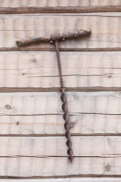 istock Old used tool decoration in wooden wall 1163130358