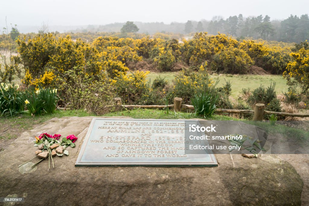 Memorial plaque to A A Milne & E H Shepard Memorial plaque to A A Milne & E H Shepard who wrote and  illustrated Winnie the Pooh, in Ashdown Forest, East Sussex, UK Christopher Robin Milne Stock Photo