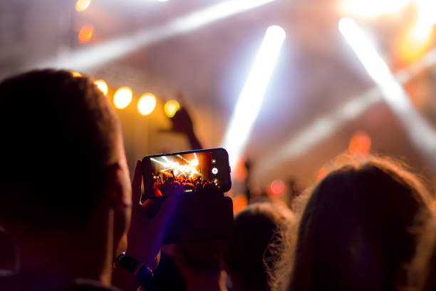 istock shooting concert on smartphone 1163132615