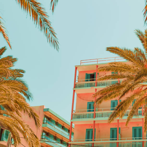 istock Hotel building and palm trees. 1163132645