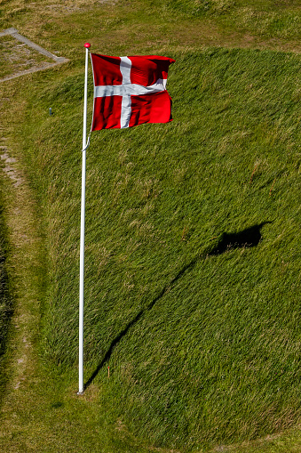 Hirtshals, Denmark A Danish flag on a flagpole.