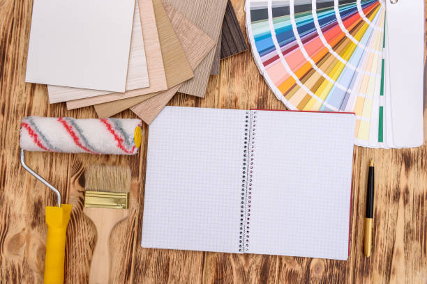istock Open notepad on table with color and wood swatch 1163133968