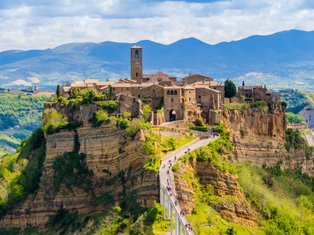 Civita di Bagnoregio, ghost mediaeval town built above a plateau of friable vulcanic tuff, Lazio, central Italy Stunning view of Civita di Bagnoregio, ghost mediaeval town built above a plateau of friable vulcanic tuff, Lazio, central Italy lazio photos stock pictures, royalty-free photos & images