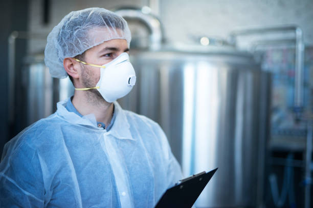 istock Technologist working in food processing factory for medical production checking quality and distribution. 1163141327