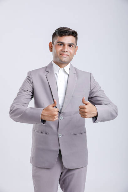 istock Young Indian Man Wearing suit and showing thumps up 1163141336