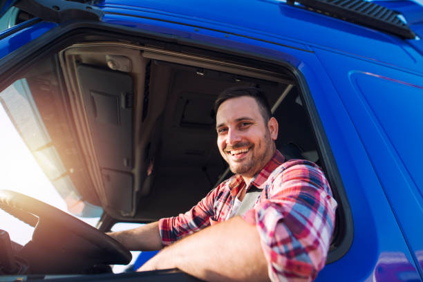 istock Professional truck driver ready for job. Transportation service. 1163142606