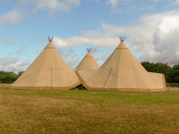 istock Three large tepees set up for a wedding event on farmland 1163143068