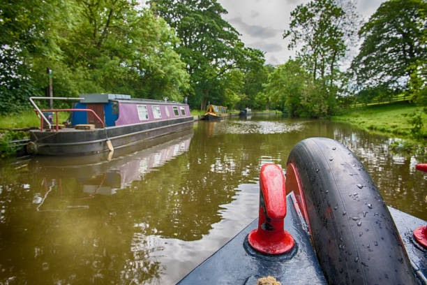 istock Narrowboats on a British canal in rural setting 1163143917