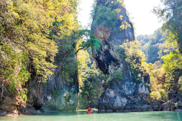 istock Colorful kayaks at tropical rock islands 1163145355