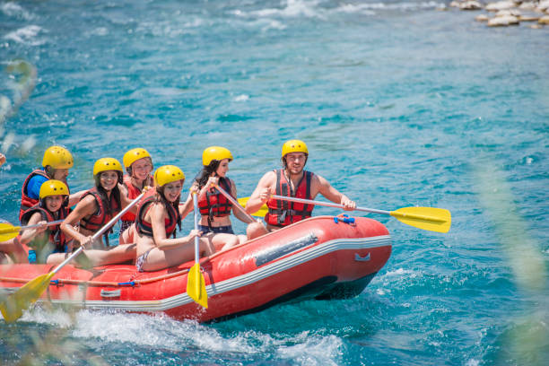 istock Group of people white water rafting 1163145700