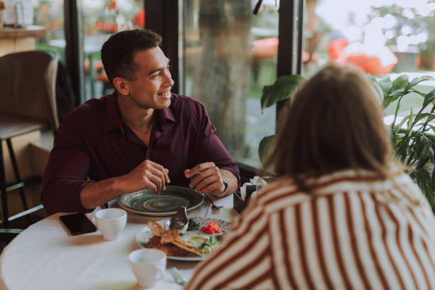 istock Two young men having meeting in cafe 1163148289