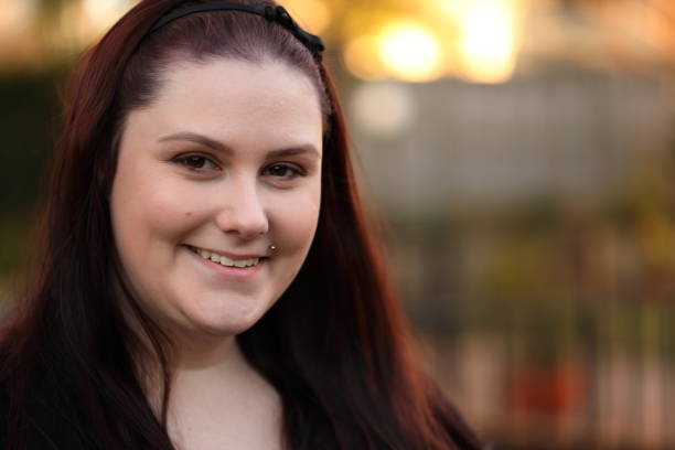 istock Smiling young woman in her backyard 1163153592