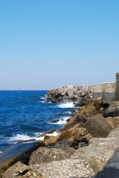 istock Beautiful blue sea and playful waves under the blue sky 1163153854