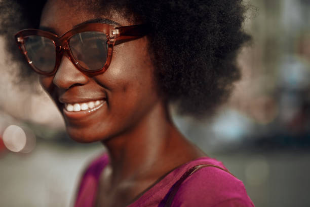istock Beautiful afro-american lady looking at camera and smiling 1163156740