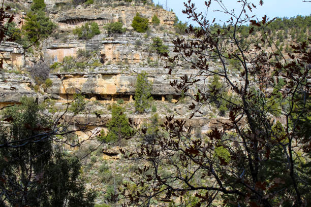 Native American mountain side dwelling from across the canyon in Walnut Canyon National Monument in Flagstaff Arizona