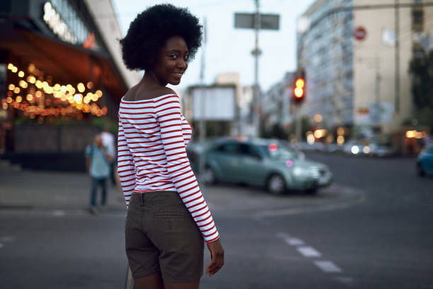 istock Happy lady with beaming smile is walking 1163158895