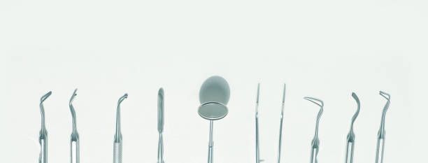 istock a various dental tools laid out flatlay on a light background 1163159927