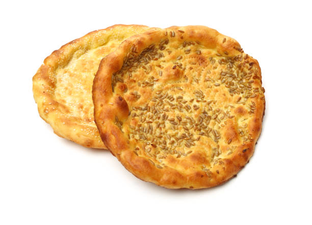 istock Homemade naan flat breads on white background 1163161562