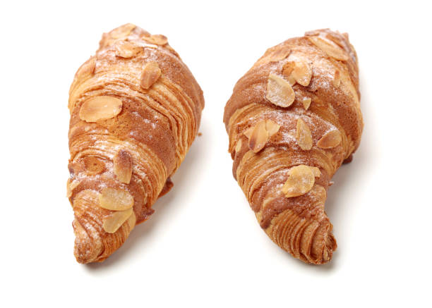 istock Fresh croissants isolated on white background 1163161588