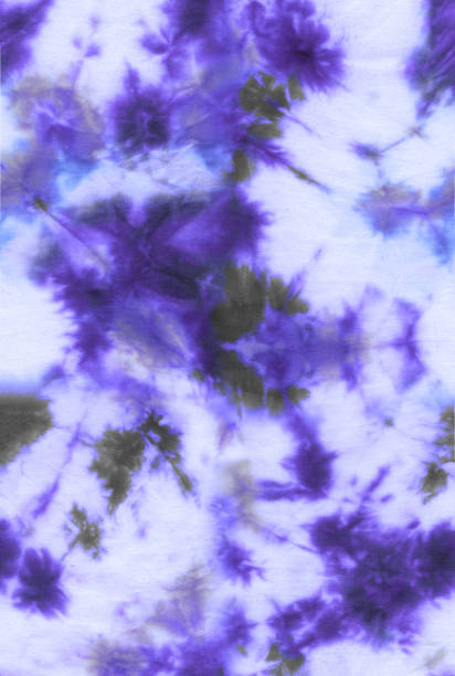 istock Abstract tie-dye hand painted fabric background with irregular floral spots 1163163355