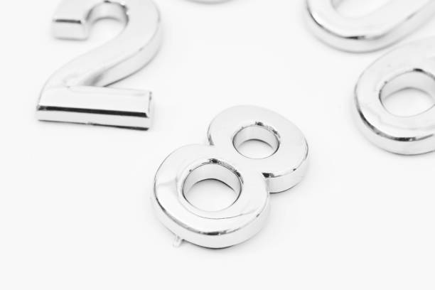 istock Silver scattered numbers on the table for mathematics concept 1163163936