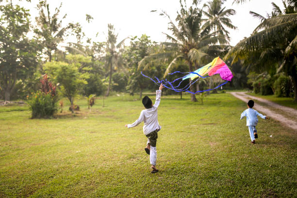 Cute kids playing with kite