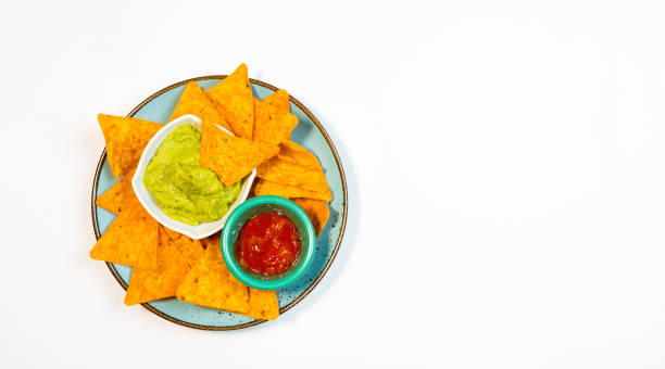 istock Guacamole sauce and spicy sauce accompanied by nachos. 1163168854