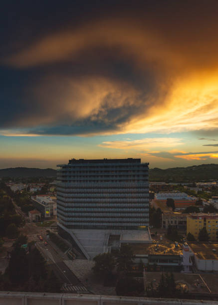 Sunset Clouds Circle Landscape photo of Nova Gorica (Slovenia - Europe) with sunset clouds colors over buildings. nova gorica stock pictures, royalty-free photos & images