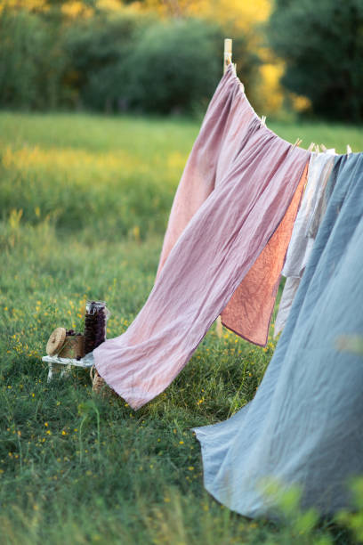 istock Clean bed sheet hanging on clothesline. 1163172260