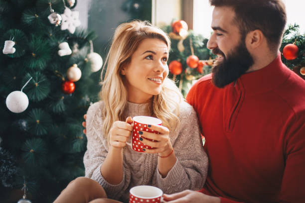 istock Couple drinking coffee together during Christmas holidays 1163174611