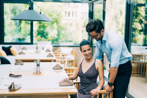 istock Romantic couple sitting in restaurant 1163174745