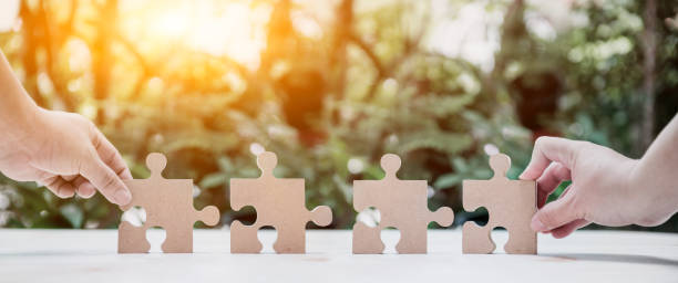 istock successful concept and goal. Business development and improvement. Puzzle and jigsaw. 1163175784