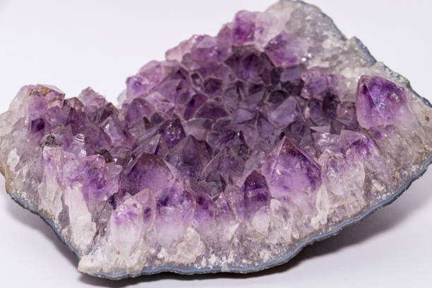 istock Geode found in europe with white and purple crystals in the inside isolated 1163176128