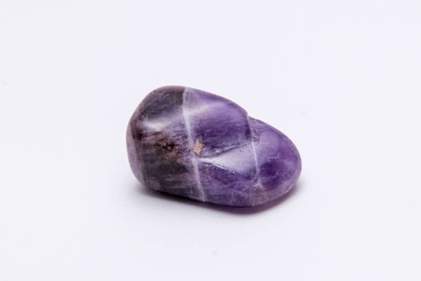 istock Fluorite precious gemstone with smooth surface purple and grey tones 1163176232