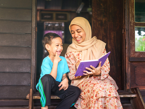 Mother read book with son