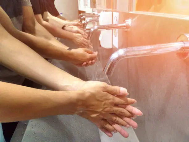 Photo of Wash your hand on the sink for cleanliness and hygiene. Wash hands with soap to clean.