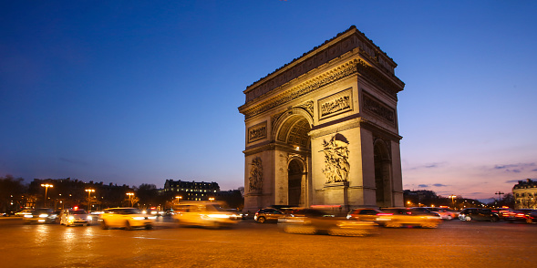 Arc de Triomphe on The Place Charles de Gaulle at night in Paris, France.
