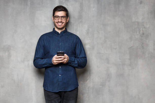 istock European man texting on his cellphone, copyspace on right, isolated 1163183107