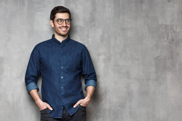 istock Young male looking aside with interest, isolated, copyspace on right 1163183108
